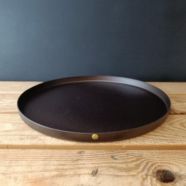 2-inch black iron baking tray by Netherton Foundry on wooden table