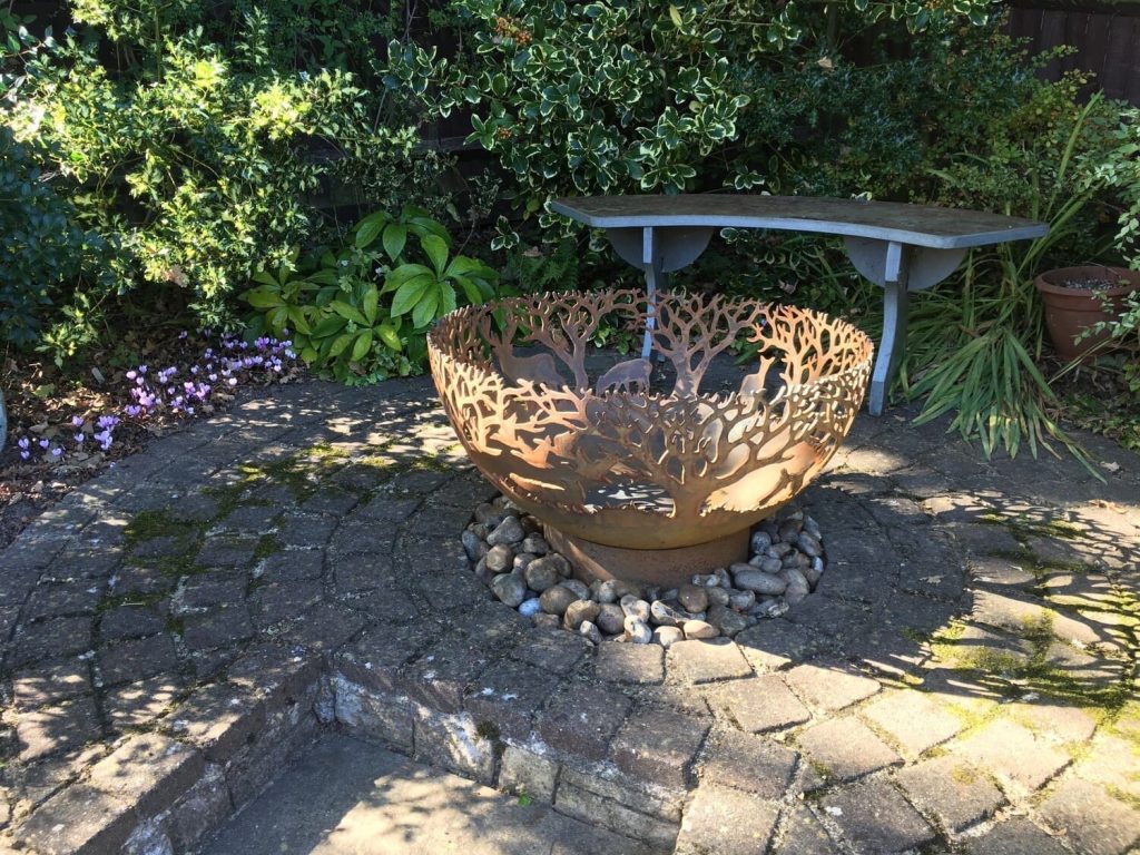 outdoor fire bowl on bed of rockery for outdoor fires