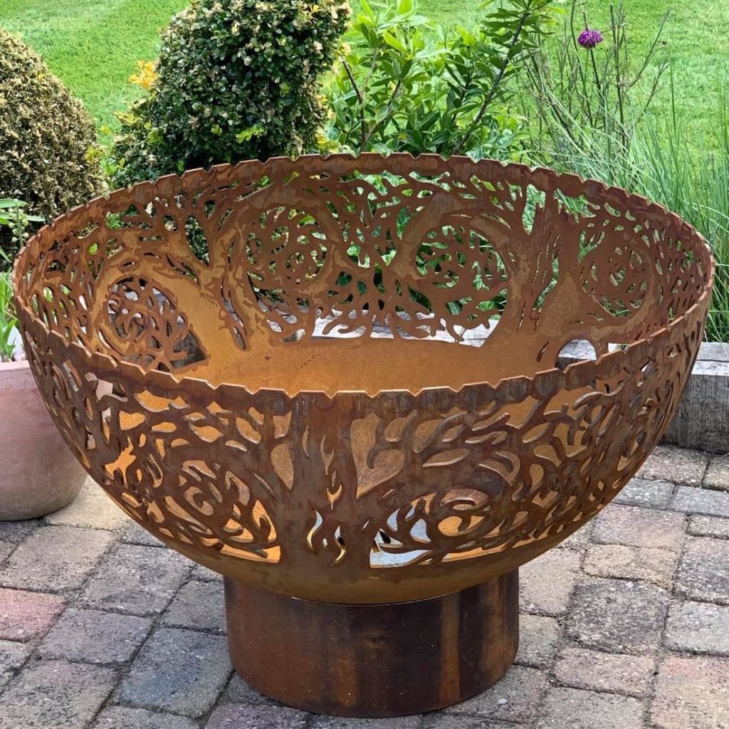 twisted tree fire bowl during day in garden