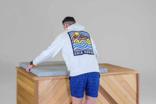 man assembling wooden hot tub 