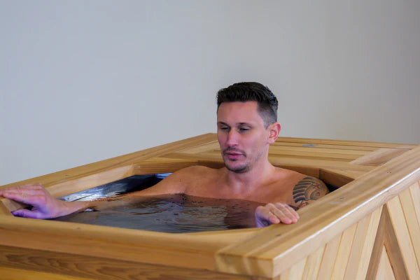 man enjoying wooden hot tub