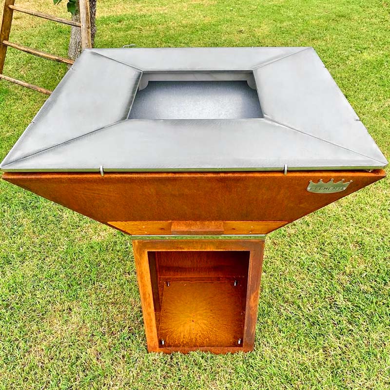 Clementi Colorado corten steel wood-fired BBQ grill in garden setting
