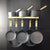 Ultimate spun iron pan set with oak wall rack, 99% iron pans arranged on hooks