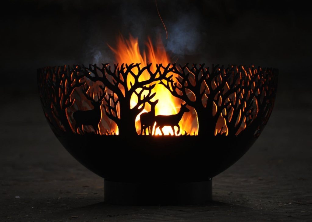 wildlife deer fire bowl at night with flames