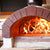 Wood-fired oven with flames inside