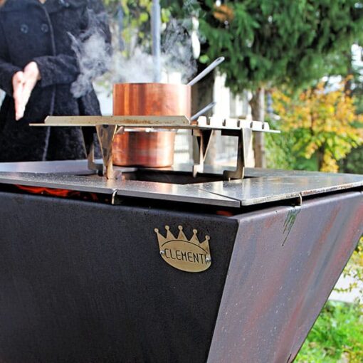 cooking with clementi wood fired grill outdoors