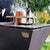 cooking with clementi wood fired grill outdoors
