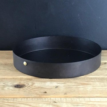 8.5-inch black iron cake tin on rustic wooden counter