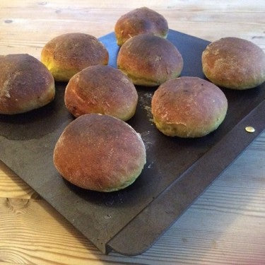 Netherton Foundry baking sheet for biscuits and bread, on rustic surface