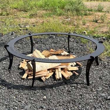 Netherton Foundry black iron paella pan stand with legs assembled, ready for fire